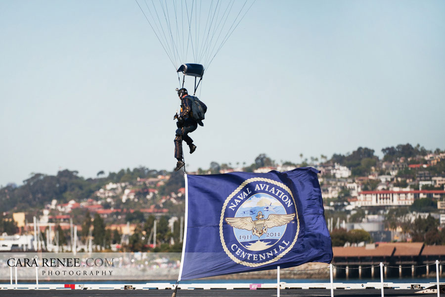 Perfect landing and on target as the Leap Frogs land on the deck of the USS JOHN C. STENNIS with the Cennential of Aviation commemorative flag.